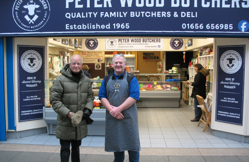 Altaf and Peter Wood outside his butchers shop